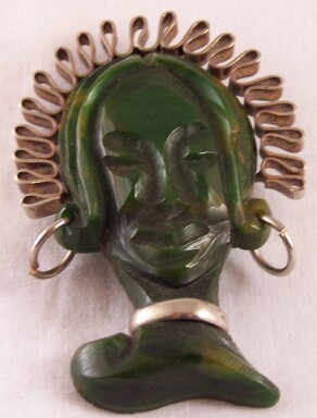 BP44 green bakelite headdress face pin